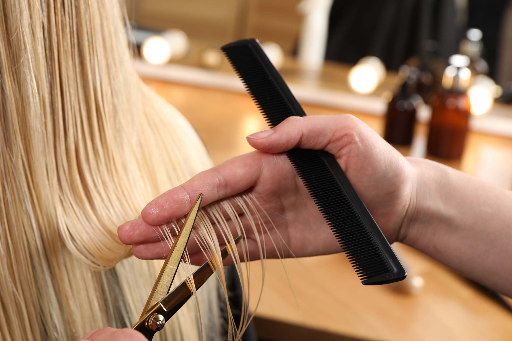 a woman getting a blonde hair treatment in boston